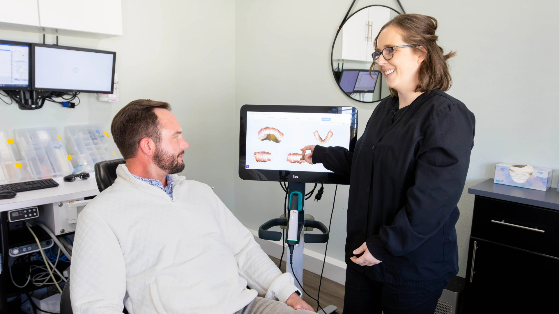 Smiling Dr in black Molis Coaching