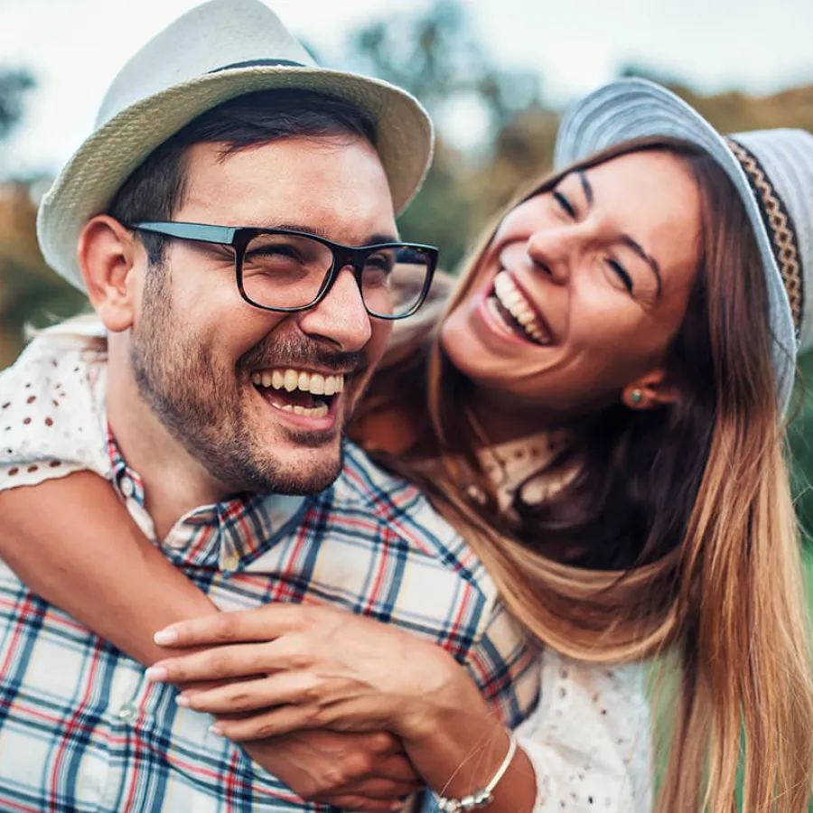 a man and woman smiling