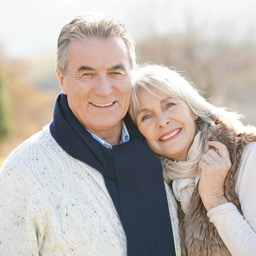 a man and woman smiling