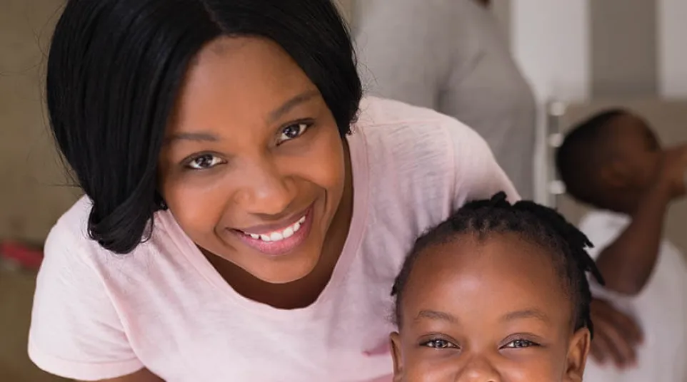 a person brushing a baby's teeth