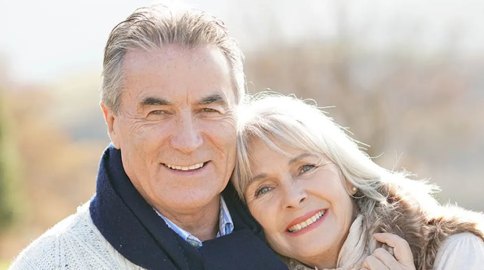 a man and woman smiling